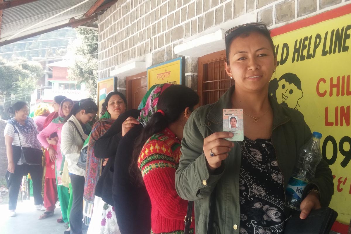Exile Tibetan Tsering Yangzom, 36, standing in queue to cast her vote to elect a member to the Dharamshala Municipal Corporation, in Bhagsu Nag, India, on 27 March 2016. Yangzom cast vote for the first time in an Indian election after Tibetans were given the right to vote in 2014.